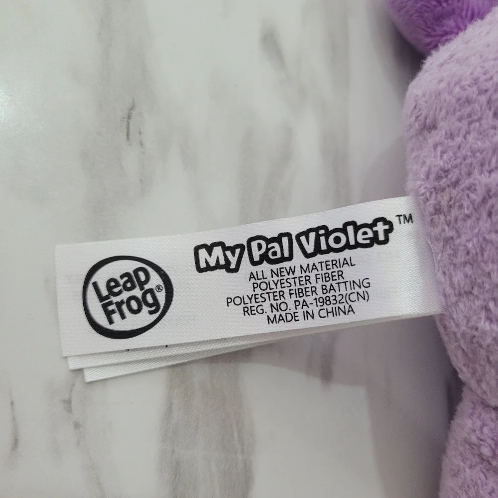 Purple and Cream Stuffed Animal Toy